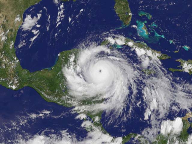 This image of Hurricane Dean arriving at the Yucatan. The clouds, including Hurricane Dean, were observed by a NOAA geostationary weather satellite (GOES-12) at 2:45 p.m. local time in Belize (on the Yucatan Peninsula) on August 20